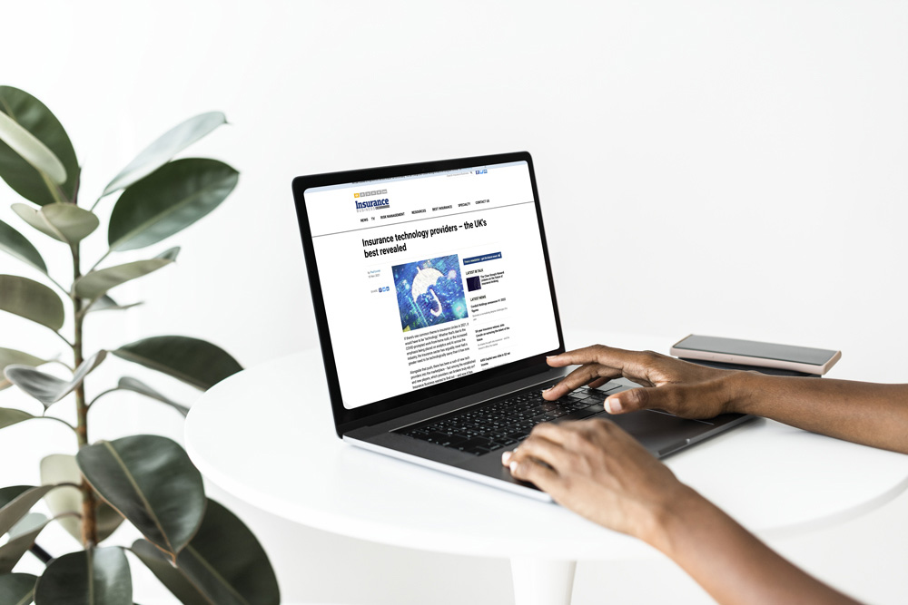 Insurance Business article 'Insurance technology providers: the UK's best revealed' open on a laptop