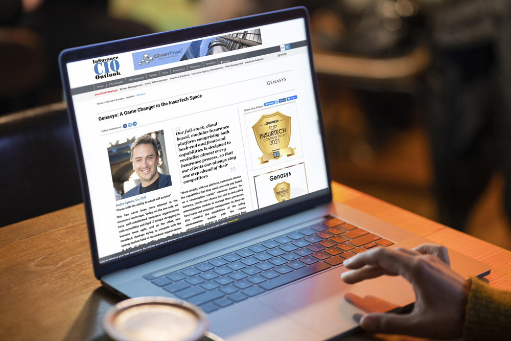 Insurance CIO Outlook article 'Genasys: A Game Changer in the InsurTech Space' open on a laptop