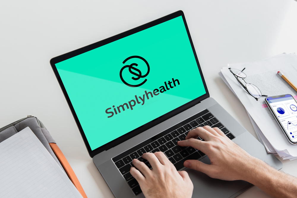 Simplyhealth logo on a laptop screen