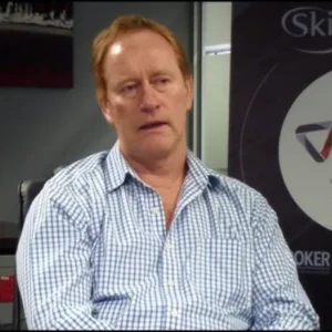 A colleague being interviewed in front of a Genasys backdrop