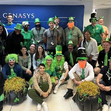 A large group of colleagues dressed in green for St Patrick\'s Day