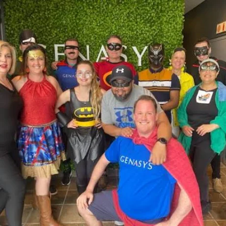 Colleagues dressed as superheroes for a costume day