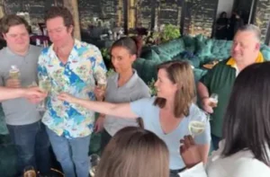 Colleagues raising glasses in a toast at a team get-together